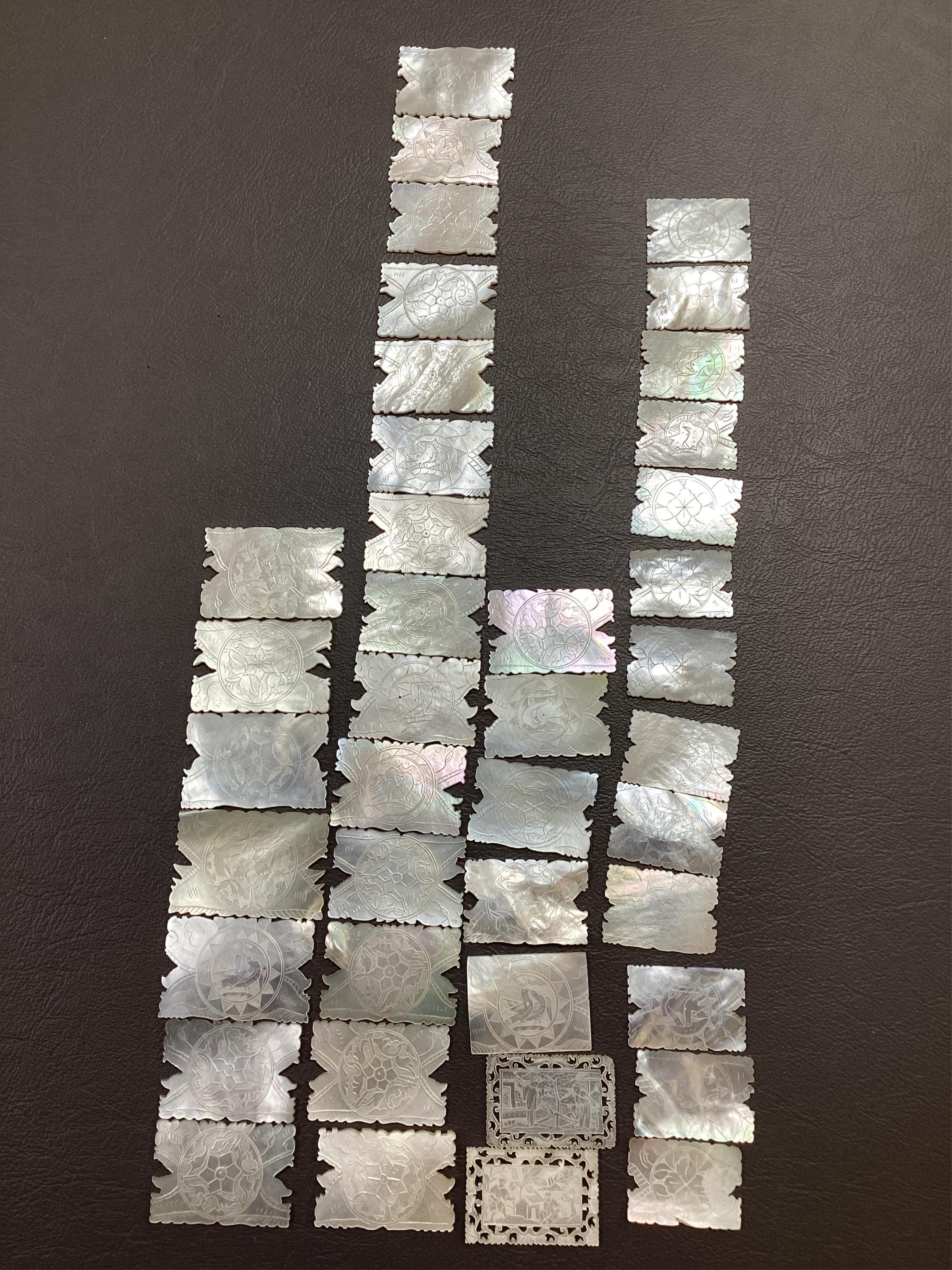 Two Chinese gilt decorated black lacquer games boxes, containing numerous mother-of-pearl counters, 19th century